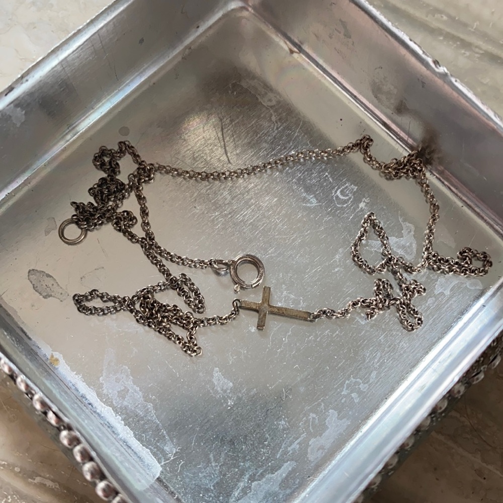 Dogeared sideways silver cross necklace